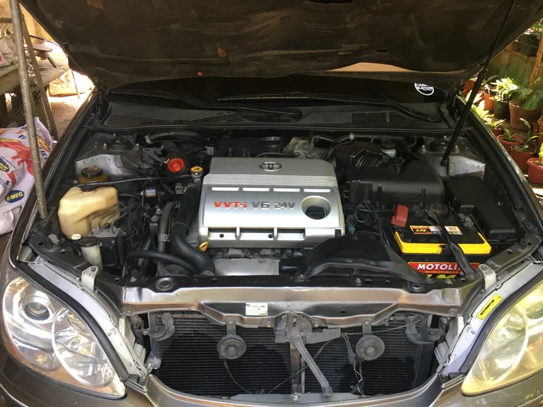 Later Toyota Camry engine bay with a VVT-i V6 24V engine cover