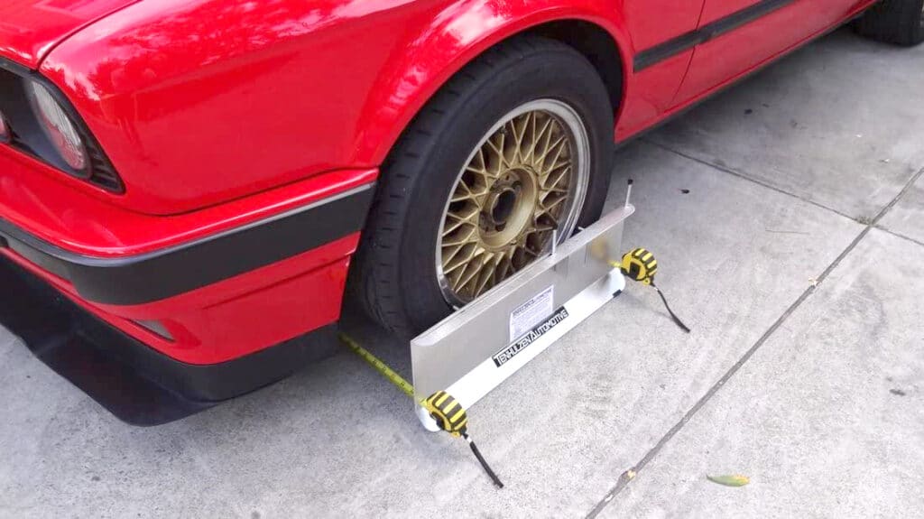 Camber plate mounted on car wheel