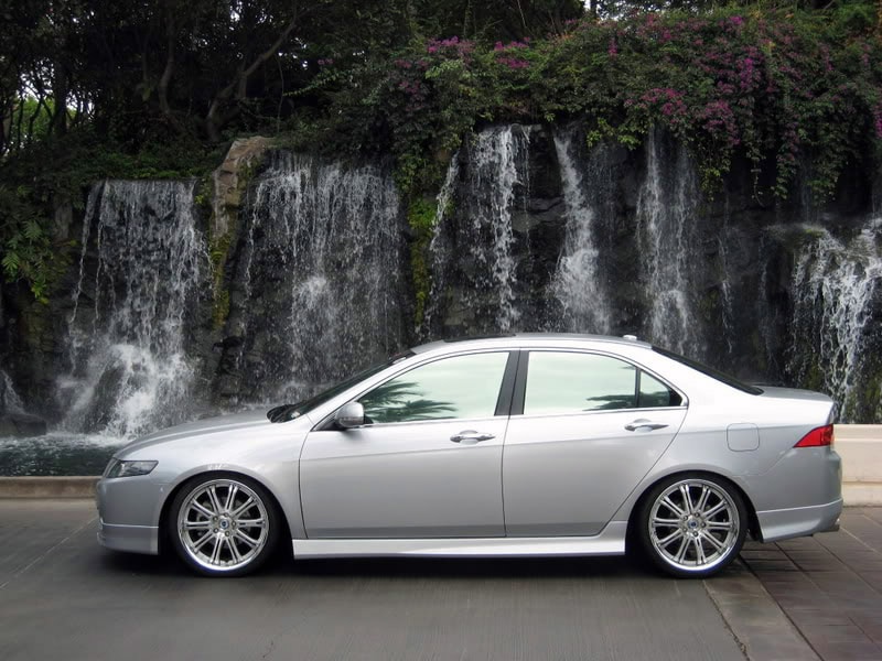 A grey sedan with reflective tint