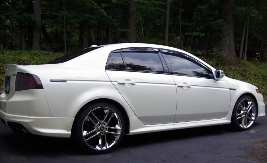 A white sedan with reflective tint