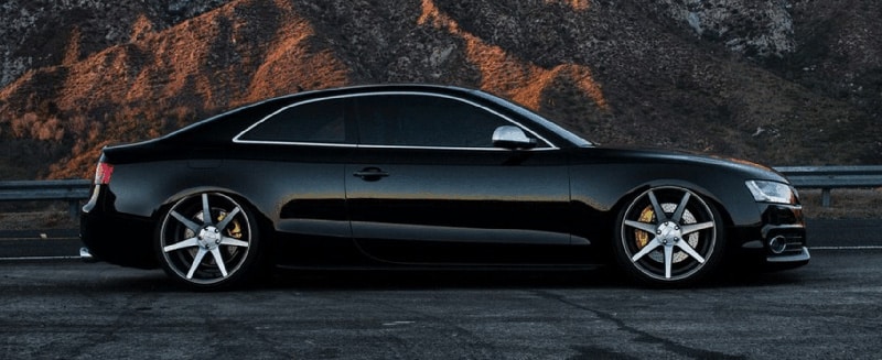 Black Audi with blacked-out windows