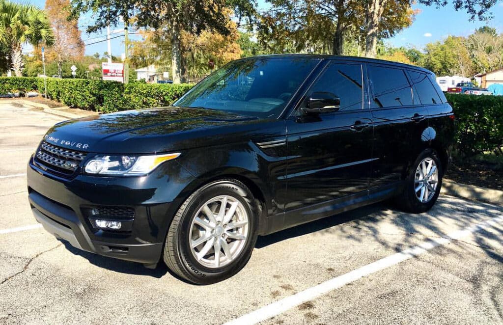 Black Range Rover with tinted windows in Arkansas