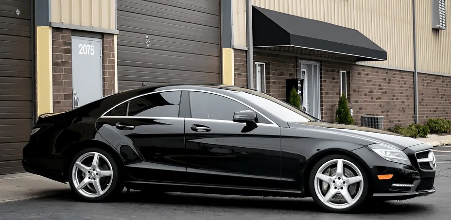 Black Mercedes-Benz with tinted windows