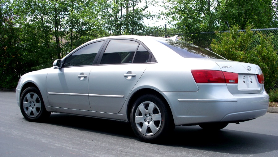 Silver Hyudndai sedan with black window tint