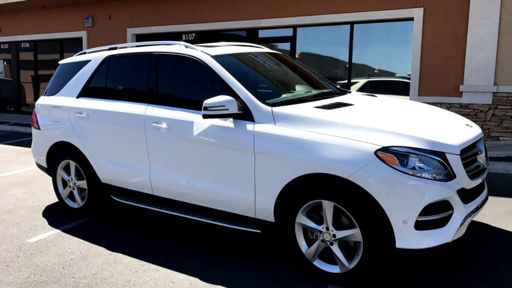 White Mercedes-Benz SUV with black window tint