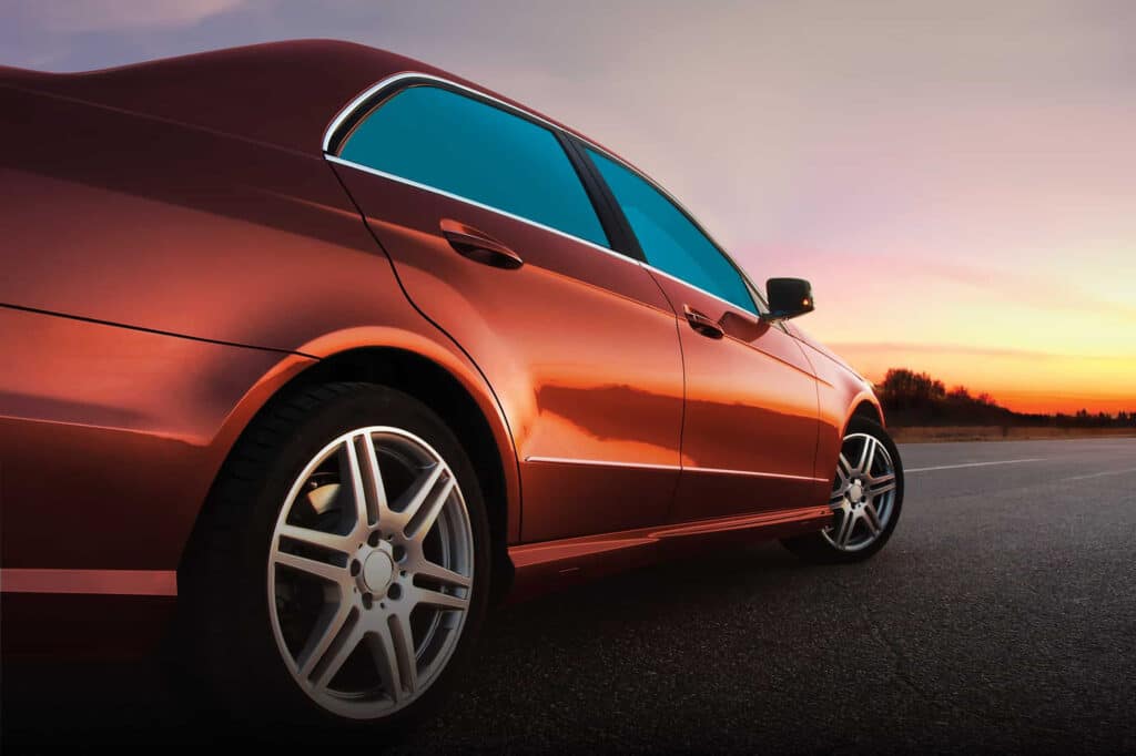 Red sedan with blue tinted windows