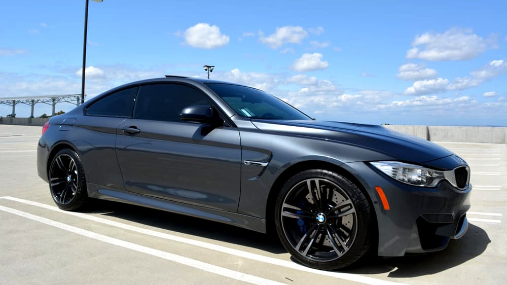 Grey BMW coupe with dark tinted windows