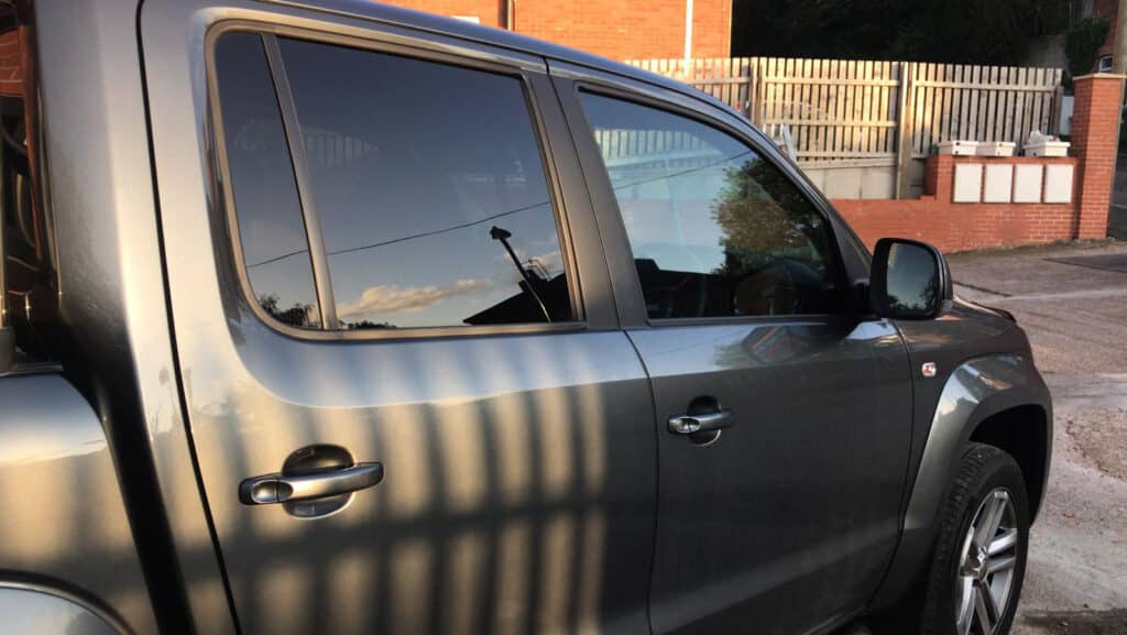 Grey pick-up truck with tinted windows