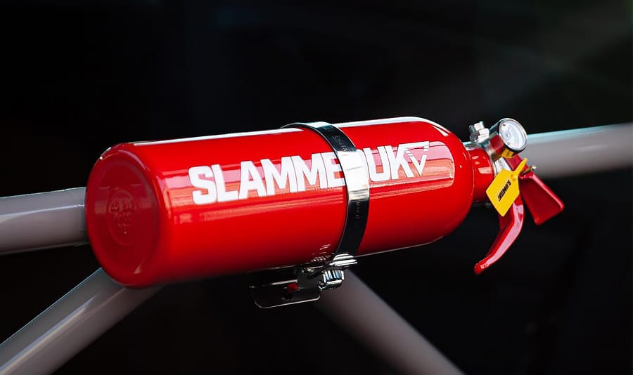 Small extinguisher installed on roll bar