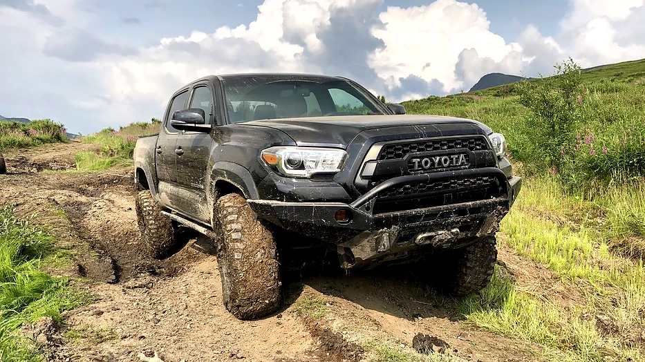A black Tacoma out on a trail