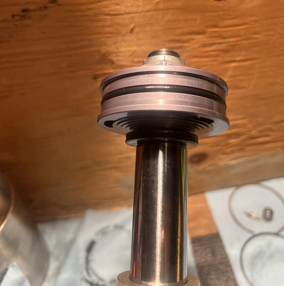 Damper piston and shim stack