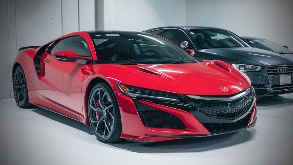 2018 Acura NSX parked next to an Audi