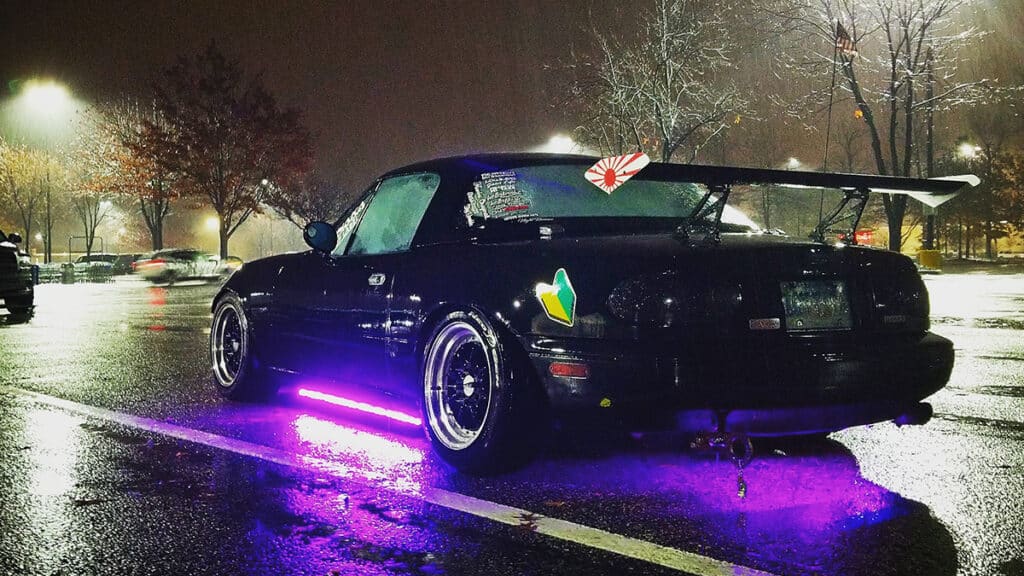 Black NA Miata with purple underglow