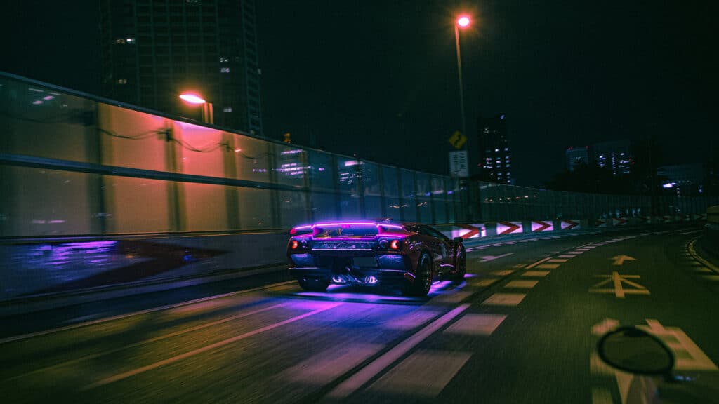 Lamborghini with pink underglow and illuminated wing