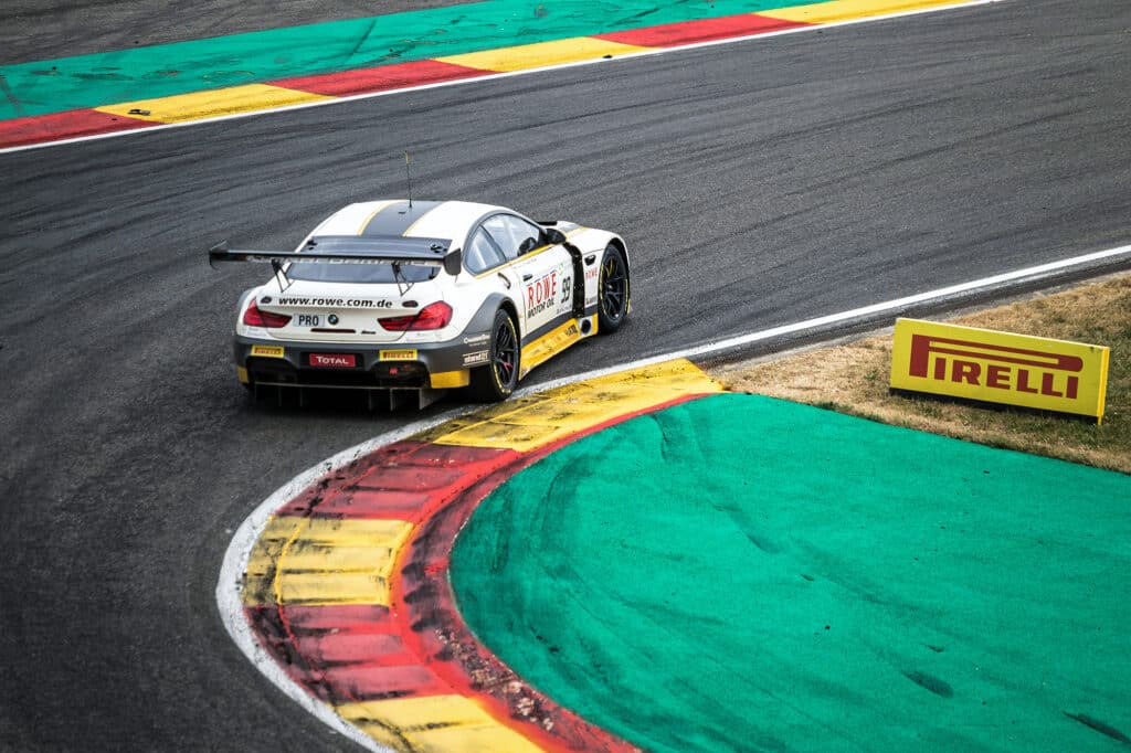 White BMW at a race track