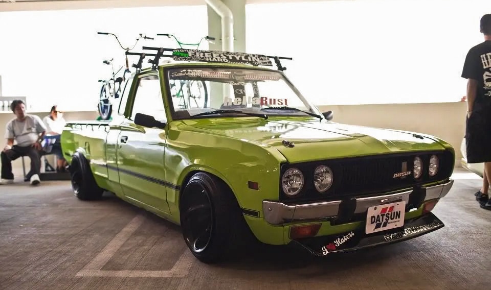 Green Datsun 510 with BMX bike mounts
