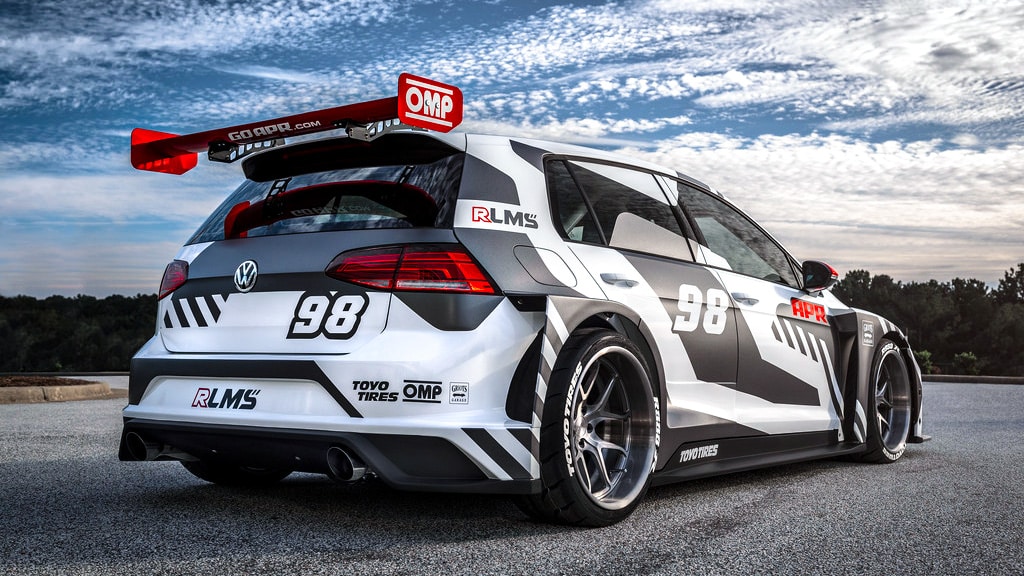 VW Golf with dished wheels at a race track