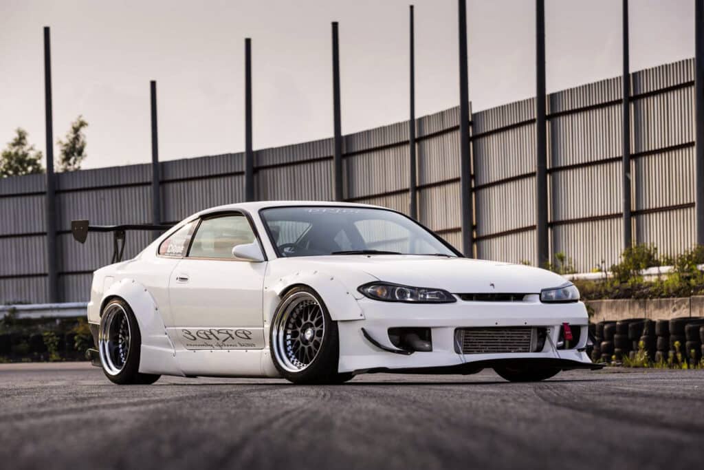 White S15 with overfenders and deep dish rims
