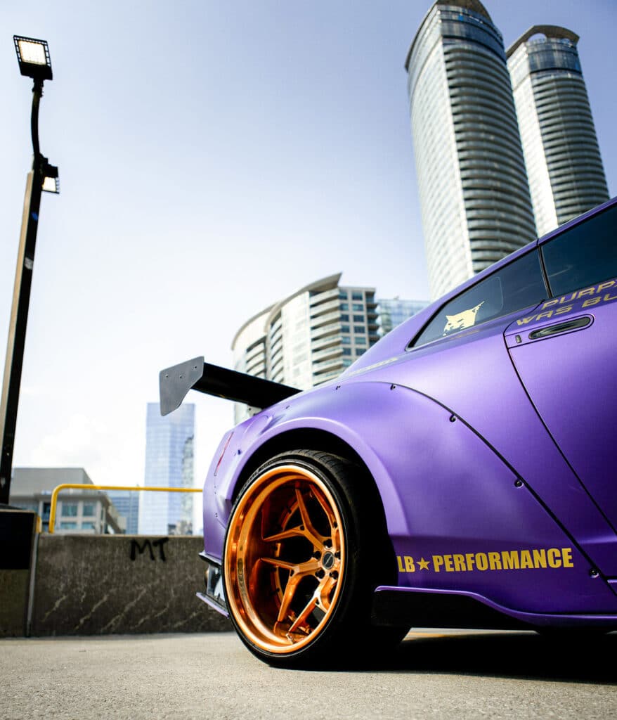 Widebody stance car with gold rims