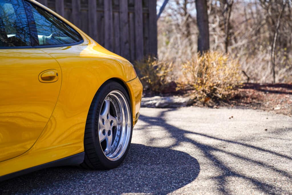 Yellow Porsche with AWC rims