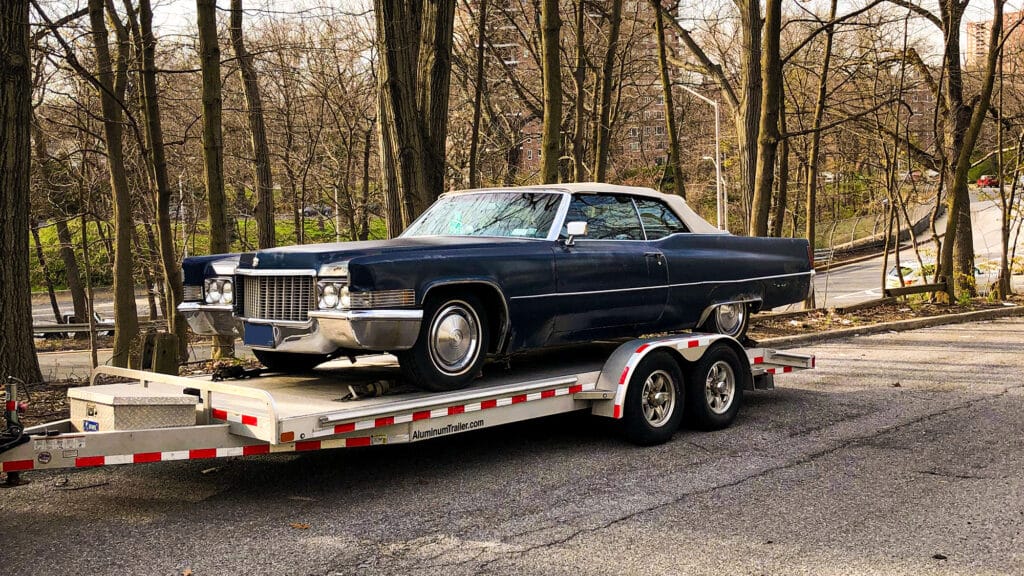 Blue Cadillac de Ville on a flatbed