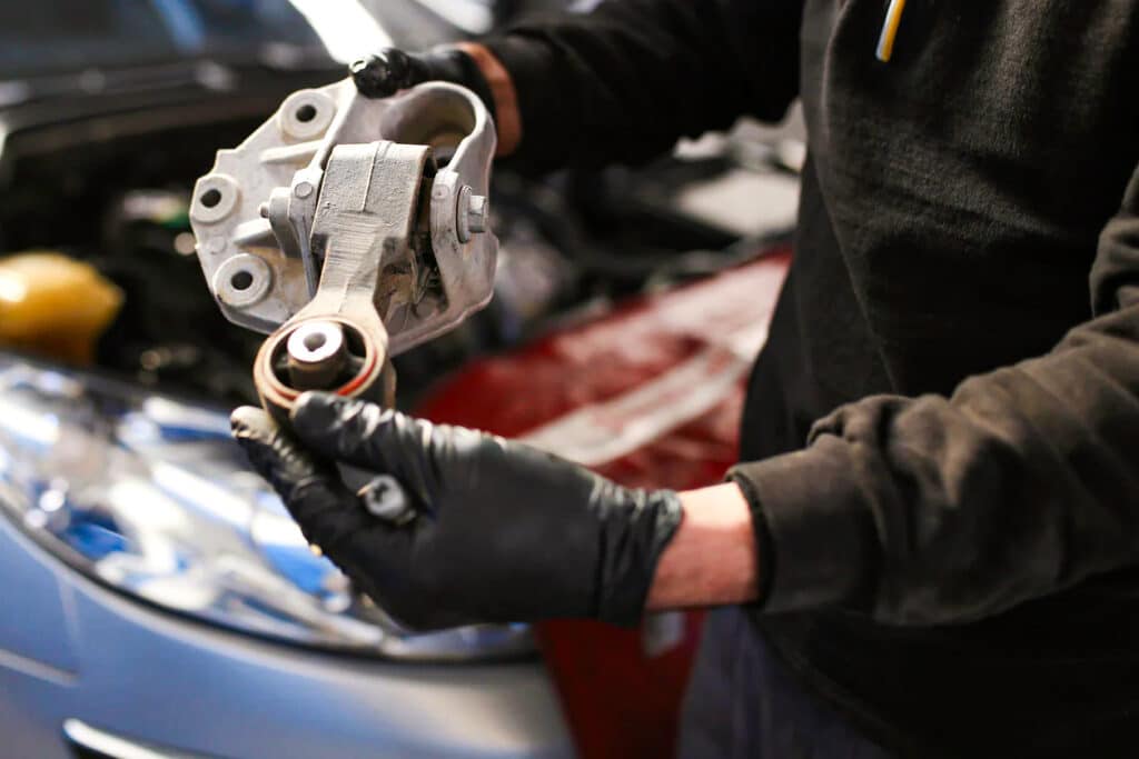 Technician holding a motor mount