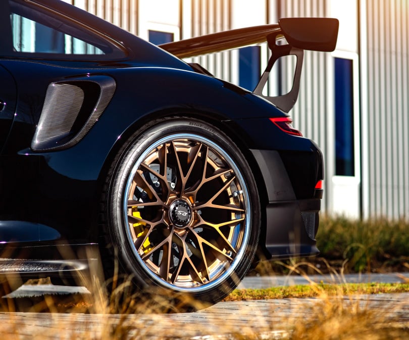 HRE wheels on a black Porsche