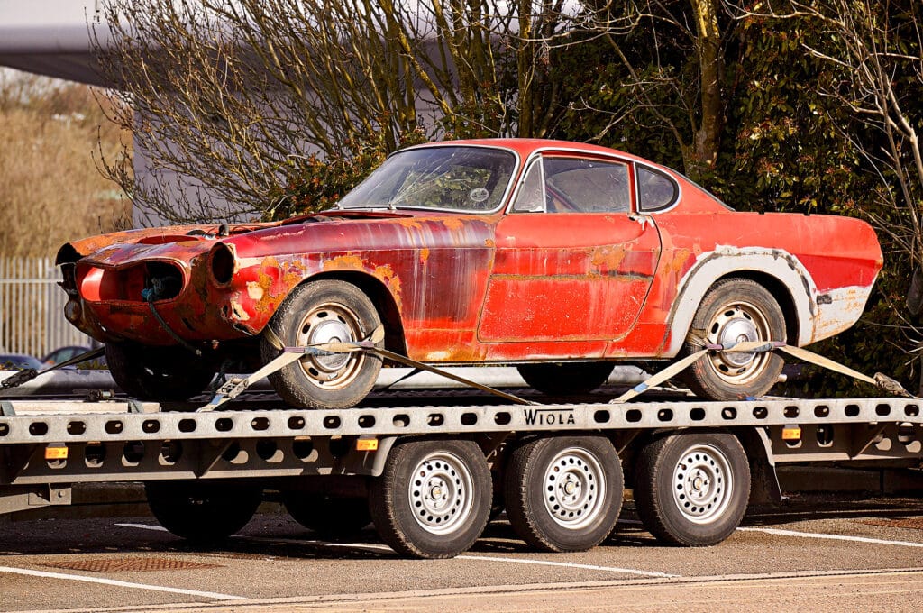 Non-running classic car on a flatbed
