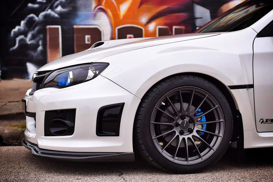 Enkei RS05-RR installed on a white WRX