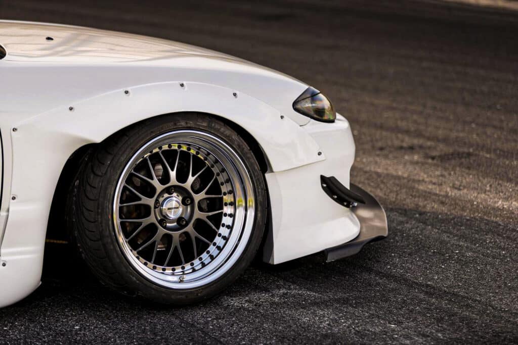 White bimmer with Work wheels