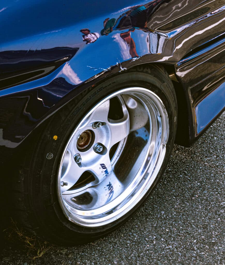 Work rims on a black Miata